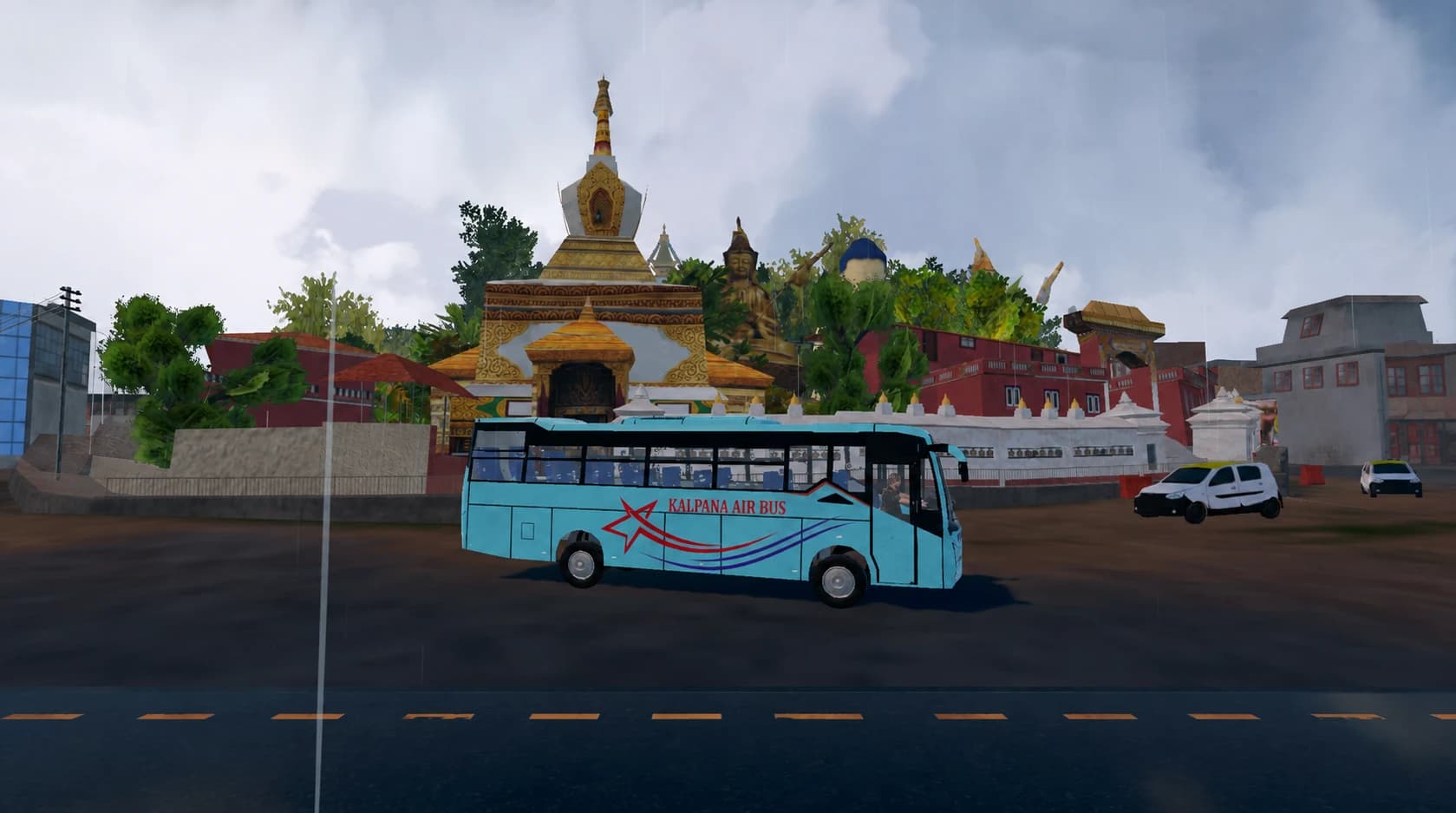 Kalpana Air deluxe bus passing a stupa in the rain